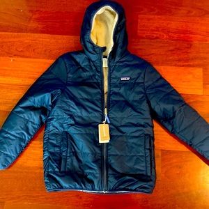 Brand new with tags reversible boys Freddy Hoody. Navy and cream size XL 14